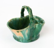 JOHN CAMPBELL green glazed pottery basket vase with branch handle, incised "John Campbell, Tasmania", 10cm high, 11.5cm wide