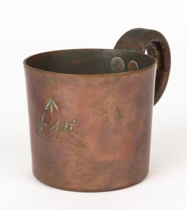 An antique half-pint copper measure with Queen Victoria cipher, mid 19th century, 8cm high, 12.5cm wide
