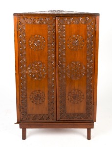 An Australian pine chip carved corner cabinet, early 20th century, 108cm high, 64cm wide, 32cm deep