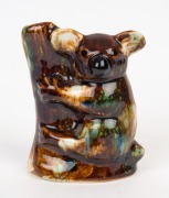 HUNTLY POTTERY koala tree stump statue with mottled glaze, stamped "Huntly Pottery", 15cm high