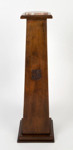 A vintage Australian stained kauri pine pedestal with rouge marble top and carved shield monogram, early 20th century, 124cm high, 26cm wide, 26cm deep