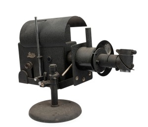 LEITZ: A tabletop enlarger incorporating a carbon arc lamp; apparently used for spectrographic work. With manufacturers plates and removable hood. Length: 64cm.