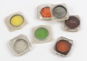 LEITZ: Group of filters comprising POOTR polarisation, FSEOO orange, GDOOK orange, GECOO No1 light red, HOOIV UVa, HOOFG green and HOOBE yellow. All housed in Leitz plastic holders. (7 items)