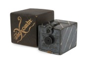 KEMPER (U.S.A.): Kombi, metal miniature box camera [#42177] with oxidized silver finish, introduced in 1892. Made to take 25 exposures on rollfilm, then double as a transparency viewer. Complete, with lens cap and original box. N.B: Additional lens cap wi - 2