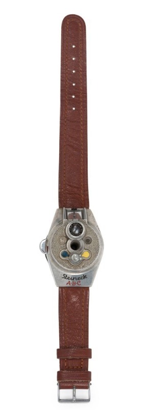 STEINECK KAMERAWERK (Germany): Steineck A-B-C wristwatch camera, c1949, for 8 exposures on circular film in a special magazine; with Steineck CL 12.5mm f2.5 lens and original brown leather wristband