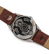 STEINECK KAMERAWERK (Germany): Steineck A-B-C wristwatch camera, c1949, for 8 exposures on circular film in a special magazine; with Steineck CL 12.5mm f2.5 lens and original brown leather wristband - 4
