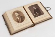 A leather bound cabinet card photo album with silver trimmings containing 29 portraits, predominantly English Archbishops, Deans, Bishops and other public figures including Lord Shaftsbury, Benjamin Disraeli, Charles Kingsley and others, circa 1880s-1890s - 2