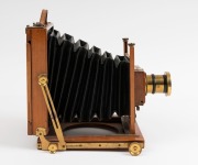 Thornton-Pickard: Amber compact folding view half plate camera (S 69305 impressed on base of shutter), circa 1899, brass bound lens and Harrington & Co., Sydney retailer's plate with additional plate "Harrington's Favorite Outfit" - 3