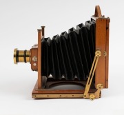 Thornton-Pickard: Amber compact folding view half plate camera (S 69305 impressed on base of shutter), circa 1899, brass bound lens and Harrington & Co., Sydney retailer's plate with additional plate "Harrington's Favorite Outfit" - 5