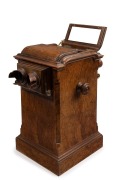 The Stereoscopic & Photographic Company (Regent Street, London): Revolving stereoscope table top stereo viewer in lovely walnut case with many cards present, circa 1895; 44cm high. - 2