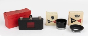 LEITZ: Accessories in original boxes: IUFOO lens hood; IWKOO lens hood; ELDIA  film-copier for 35mm film. (3 items).