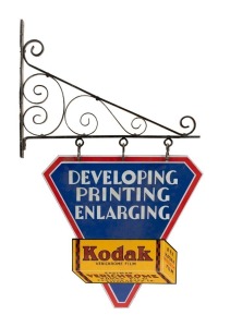 "KODAK VERICHROME FILM, DEVELOPING, PRINTING, ENLARGING" vintage tin enamel double sided advertising sign with original wrought iron bracket, circa 1930, the sign 43cm high, 43cm wide, 80cm high overall including bracket