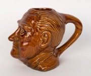 JOHN McEWAN&nbsp;pottery charcter&nbsp;jug by EWAN McDonald, circa 1967. McEwan&nbsp;was Prime Minister for only 22 days being appointed after the disappearance of Harold Holt. Incised "Ewan McDonlald", 15cm high - 2