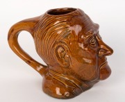 JOHN McEWAN&nbsp;pottery charcter&nbsp;jug by EWAN McDonald, circa 1967. McEwan&nbsp;was Prime Minister for only 22 days being appointed after the disappearance of Harold Holt. Incised "Ewan McDonlald", 15cm high - 3