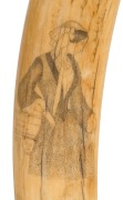 An antique scrimshaw walrus tusk with female and male portraits, 19th century, 38cm long - 3