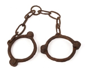 CONVICT LEG IRONS, blacksmith made, early 19th century, lovely relic condition, ​​​​​​​74cm long