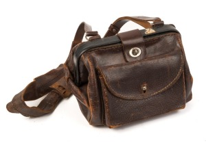 ADELAIDE MTT TRAM CONDUCTORS BAG: circa 1950's, Municipal Tramways Trust leather bag with original strap and inserted metal cash tray. 20cm high, 30cm wide.