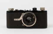 LEITZ: Leica I, Model B Compur Rim Set Shutter camera, 1929, [#13297 series] making it the 143 camera in the series. The total production was 1072 units. The camera has a round base accessory shoe; Elmar f3.5 50mm lens, Shutter #2008474. - 2