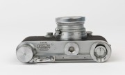 LEITZ: Leica Model IIIa Chrome D.R.P. 2nd Line [#332619], 1939, with Summitar f2 50mm lens [#489900], a Leitz yellow filter and a Leica metal cap. Camera base fitted with SCNOO Rapid Winder. - 3