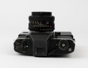 LEITZ: Leica Model Leicaflex SL Mot Black [#1372621], 1974, with Summilux-R f4 50mm lens [#2493110]. Leicaflex Motor Drive attached to base. - 4