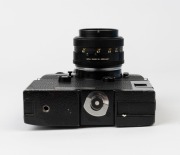 LEITZ: Leica Model Leicaflex SL Mot Black [#1372621], 1974, with Summilux-R f4 50mm lens [#2493110]. Leicaflex Motor Drive attached to base. - 5