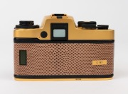 LEITZ: Leica R4 Gold [#1651925] pale brown snakeskin body cover and C157 number plate affixed on rear of body, 1984, with a gold and black special edition Summilux-R f4 50mm lens [#3295897]. Original felt-lined presentation timber case, box, paperwork and - 3