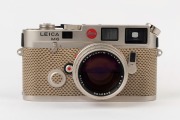 LEITZ: Leica M6 Limited Edition [#1757922], platinum and reptile skin, 1989, with engraved top plate commemorating the 150th anniversary of photography and the 75th anniversary of Leica, A122 of 1250. Fitted with Summilux-M f4 50mm lens [#3482400] and in - 3