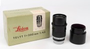 LEITZ: Telyt&nbsp;200mm f4.5 telephoto screw mount lens [#1501100], 1957, with rear metal cap in fitted original Leitz box. Together with Leitz removable&nbsp;lens hood [TNGOO]. - 2