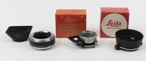 LEITZ: Accessories group including NOOKY close focus adaptor for Elmar 50mm in original box, Leica 13352X swing out polarising filter hood POOTR in original box, a Leicaflex adaptor (14167) for M lens to R cameras and a Summarom 28mm SOOBK lens hood. (4 items)