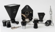 LEITZ: Accessories group including two LVFOO&nbsp;focal magnifiers, PEGOO magnifier,&nbsp;Mikas&nbsp;Micro-Ibso attachment, CALOS&nbsp;auto release attached to GIIBR wire release prism and GIIFT wire release, CALOS automatic release, OORES rotating stage, MAKAM microscope at