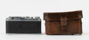 CANON HANSA 35mm rangefinder camera, [#1082], 1937, with Nikkor 50mm f3.5 collapsible lens [#50712]; pop up viewfinder, base plate #2743; "HANSA" engraved on top plate; metal lens cap and original Canon HANSA ERC&nbsp;with straps. - 3