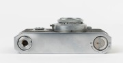 CANON HANSA 35mm rangefinder camera, [#1082], 1937, with Nikkor 50mm f3.5 collapsible lens [#50712]; pop up viewfinder, base plate #2743; "HANSA" engraved on top plate; metal lens cap and original Canon HANSA ERC with straps. - 5