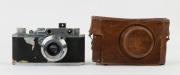 CANON NS rangefinder camera [#10880], 1941-42, with Nikkor 50mm f3.5 lens [#501380] in shutter #1917; pop up rangefinder; Canon Seiki-Kogaku&nbsp;engraved on top plate. With Canon ERC with straps. [NB: While the vulcanite body covering has deteriorated [see pi - 2