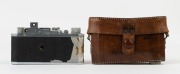 CANON NS rangefinder camera [#10880], 1941-42, with Nikkor 50mm f3.5 lens [#501380] in shutter #1917; pop up rangefinder; Canon Seiki-Kogaku&nbsp;engraved on top plate. With Canon ERC with straps. [NB: While the vulcanite body covering has deteriorated [see pi - 3