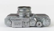 Canon 'Canon Camera Company Ltd' S-II rangefinder camera [#18712], 1947-48, with Serenar 50mm f2 lens [#20382] with metal cap; the bottom plate engraved "Made in Occupied Japan". - 4