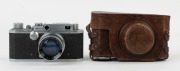 Canon 'Canon Camera Company Ltd' S-II rangefinder camera [#22841], 1947-48, with Serenar 50mm f2 lens [#21545]; the bottom plate engraved "Made in Occupied Japan". With Canon leather ERC with straps. - 2