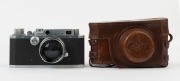 Canon 'Canon Camera Company Ltd' S-II rangefinder camera [#22991], 1947-48, with Serenar 50mm f1.9 lens [#22477]; the bottom plate engraved "Made in Occupied Japan". With Canon leather ERC with straps. - 2