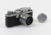 Canon 'Canon Camera Company Ltd' 11B&nbsp;rangefinder camera [#38035], 1950, with Nikkor-HC&nbsp;50mm f2 lens [#628932] with metal cap; the bottom plate engraved "Made in Occupied Japan".