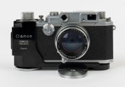 Canon 'Canon Camera Company Ltd'&nbsp; Model 11B&nbsp;rangefinder camera [#38508], 1950, with Serenar&nbsp;50mm f1.9 lens [#28832]; the bottom plate engraved "Made in Occupied Japan". Displayed in a Canon Camera Holder (Type 2) with metal tripod mount. - 2