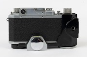Canon 'Canon Camera Company Ltd'&nbsp; Model 11B&nbsp;rangefinder camera [#38508], 1950, with Serenar&nbsp;50mm f1.9 lens [#28832]; the bottom plate engraved "Made in Occupied Japan". Displayed in a Canon Camera Holder (Type 2) with metal tripod mount. - 3