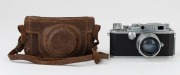 Canon Model IIF rangefinder camera <E.P>, 1955 [#151590; model identified on loading diagram] with Serenar f1.8 50mm lens [#63881] and Canon ERC with straps. - 2