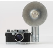 Canon Model IIS2 rangefinder camera <E.P.>, 1955-56 [#192525] with Canon f1.8 50mm lens [152165], Canon Rapid Winder [#12023] and Canon Flash Unit - Y [#18363]; previous owner's name neatly engraved at rear of top plate. - 2