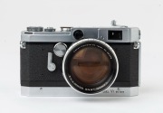 Canon rangefinder camera Model VT deluxe, 1957 [#549611] with Canon 50mm f1.2 lens [#25379] and Canon lens hood. - 2
