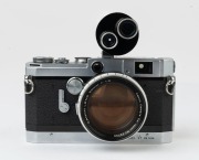 Canon rangefinder camera Model VT deluxe, 1957 [#549390] with 50mm Canon f1.2 lens [#32723] and Canon twin-turret zoom finder II [#11097]. - 2