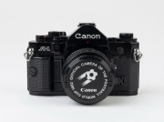 Canon A-1 SLR camera,1979 [#1952746] with Canon FD 50mm f1.4 lens [#3466358] and commemorative lens cap "OFFICIAL CAMERA OF THE FOOTBALL WORLD CUP 1982". - 2