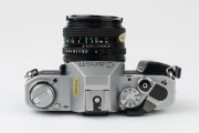 Canon AL-1 QF SLR camera, 1982 [#1097585] with Canon FD 50mm f1.8 lens [#5980840], the commemorative lens cap "OFFICIAL 35MM CAMERA * 1984 OLYMPIC GAMES". - 4
