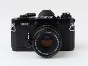 Canon EF SLR camera, 1973 [#324685] with Canon FD 50mm f1.8 S.C. lens [#769441]. - 2