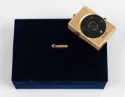 CANON: Elph IXUS 18k gold-plated Limited Edition complete kit (with documentation) [#001977] in velvet-lined presentation case. Issued in 1997 to commemorate the 60th anniversary of the Canon Company. - 3