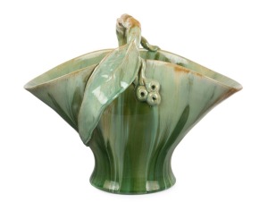 REMUED green glazed pottery basket vase with applied gumnuts, leaf and branch handle, incised "Remued Hand Made 194/12M", 25cm high, 31cm wide