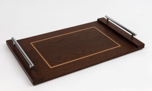 A vintage Australian serving tray, blackbean and huon pine with chrome handles, late 20th century, 54cm across the handles